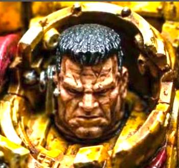 Close-up portrait of Tor Garadon framed by weathered yellow armour.